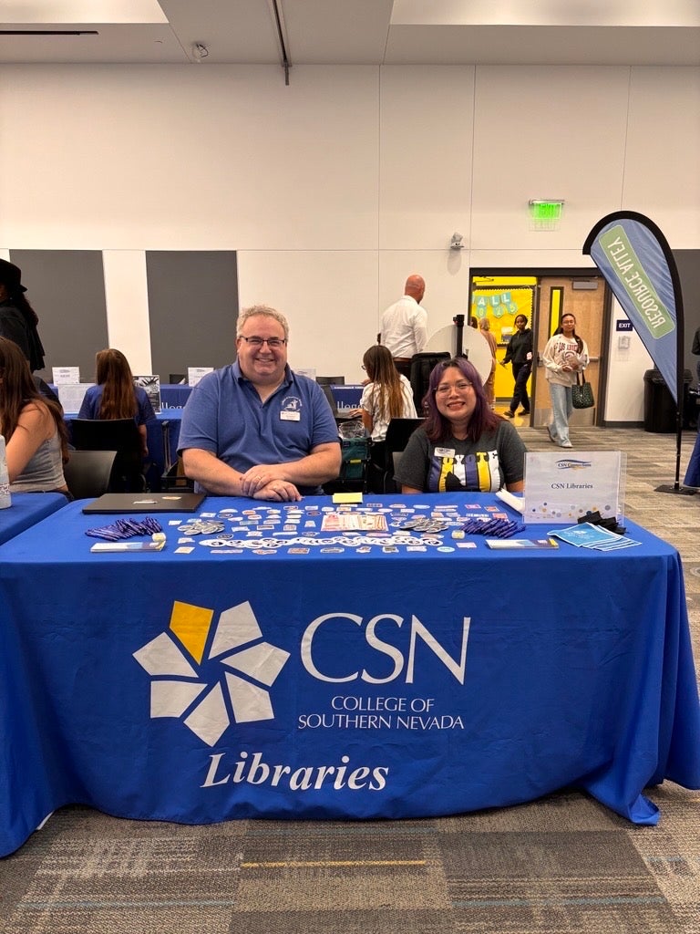 Librarians Ted Chodock and Carrieann Cahall tabling