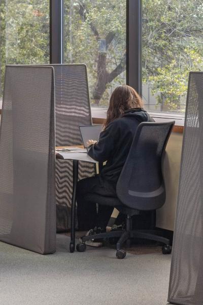 A photo of a student sitting at a desk