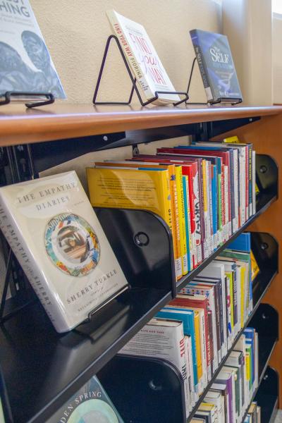 A photo of a bookshelf at the Henderson campus library