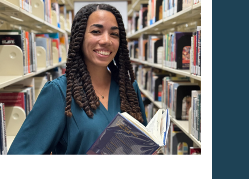 Photo of Tiera King holding a library book